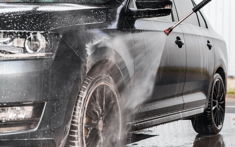 A car at a self-service carwash, WyattWorksCleveland.