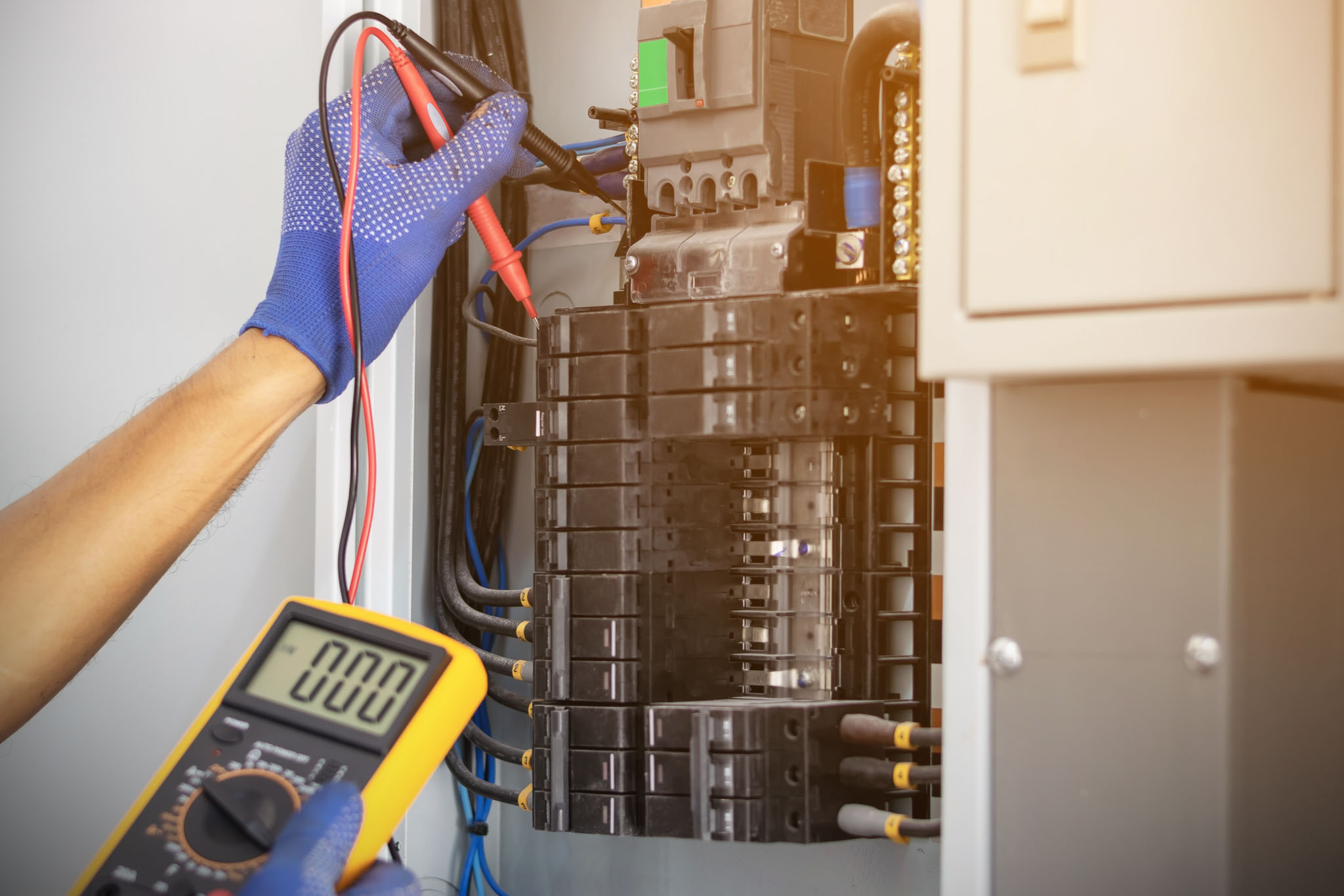 A circuit board being serviced by an electrician - get professional electrical repair in Cleveland, OH with WyattWorks.