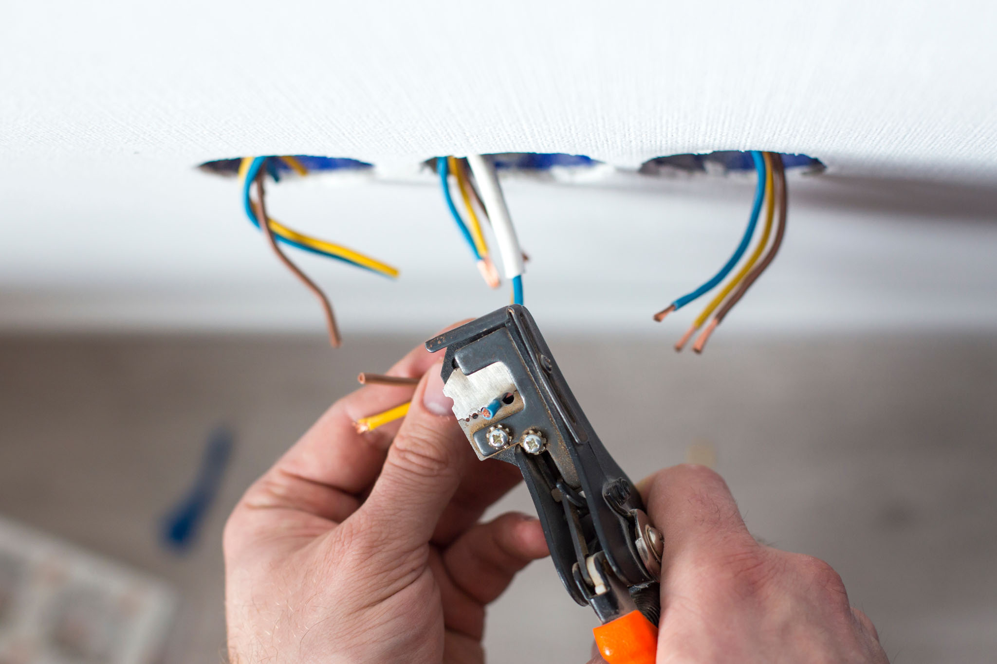 An electrician troubleshooting wiring issues.