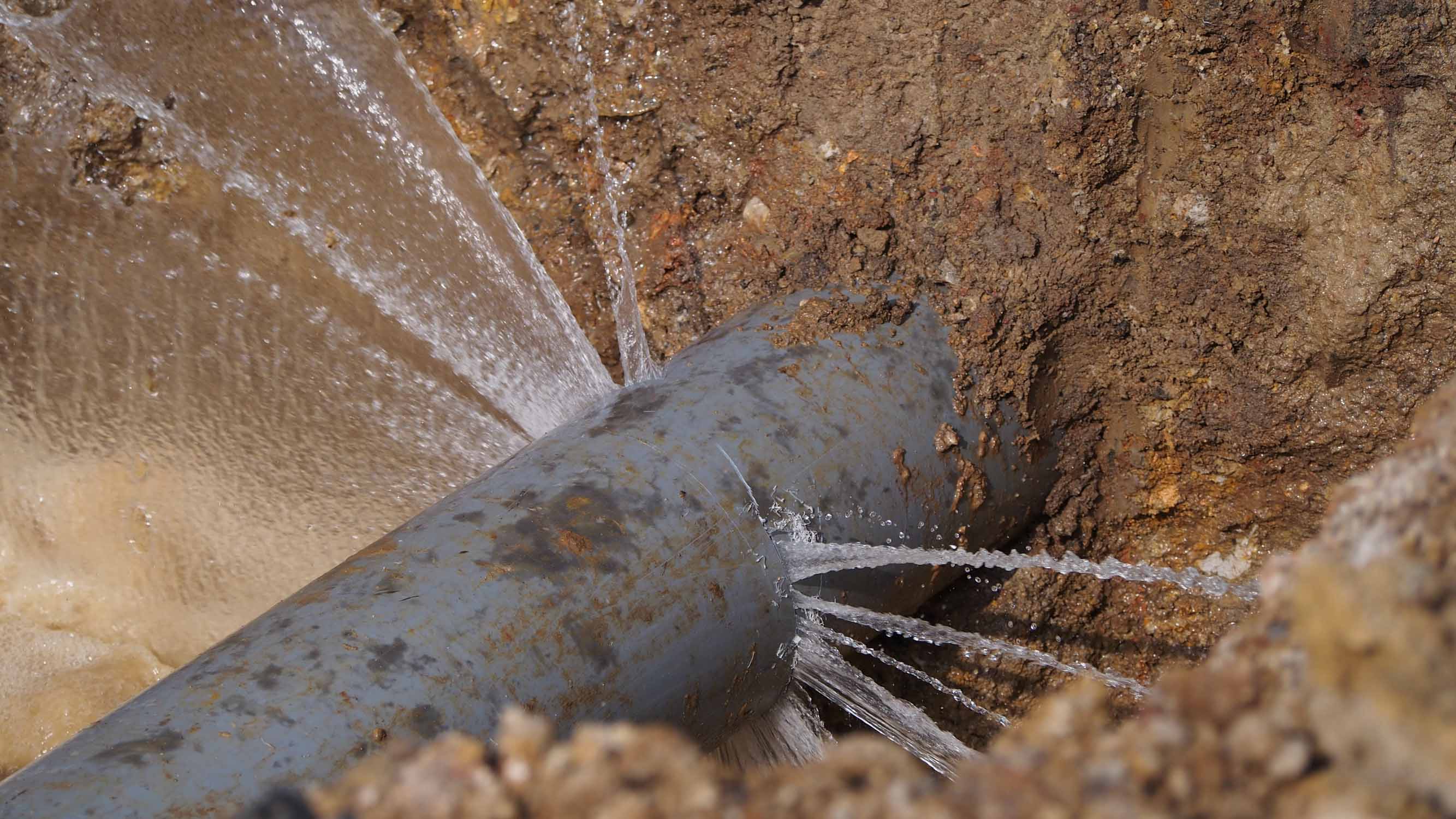 A pipe in the ground leaking into the dirt, call WyattWorks for your plumbing excavation in Cleveland, OH.