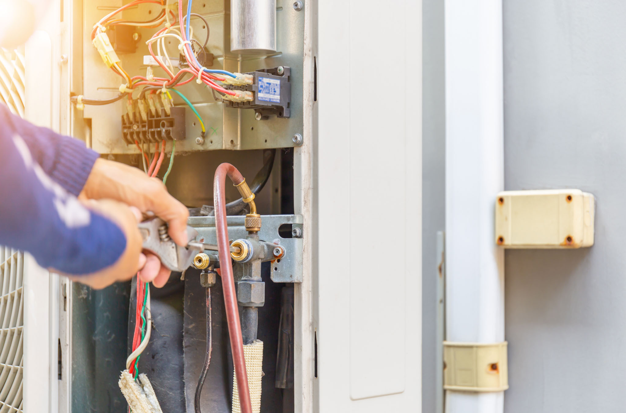 An image of a furnace getting serviced by a professional.
