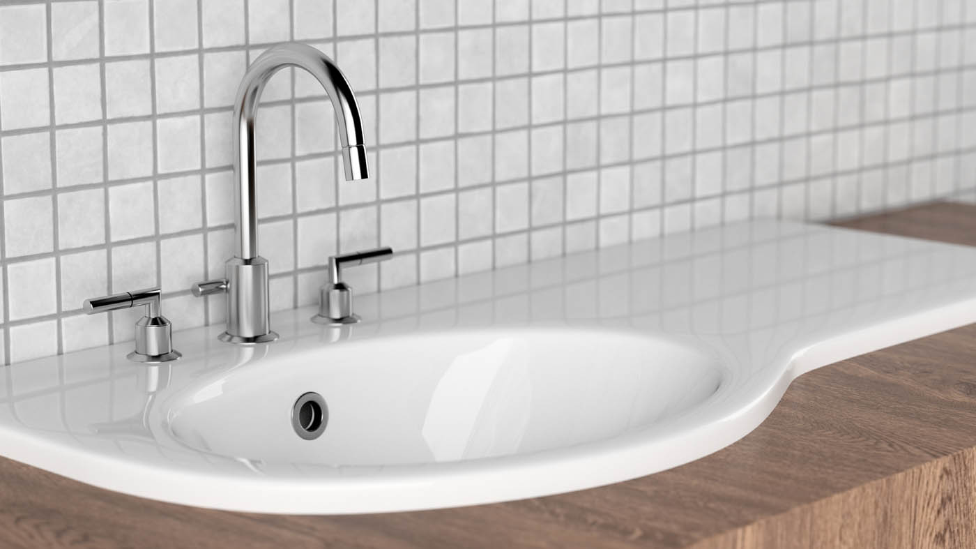 A white sink in front of white tile, WyattWorks in Cleveland.