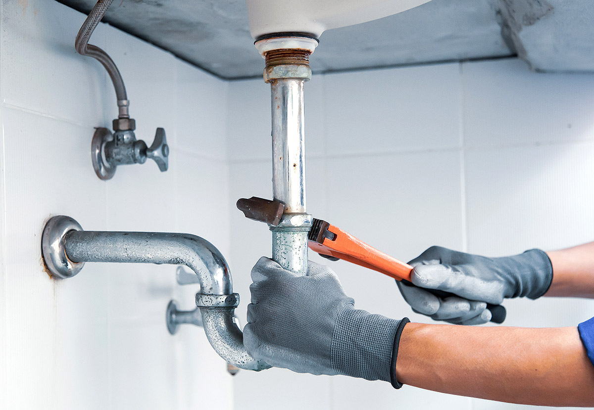WyattWorks Cleveland service provider fixing a leak.